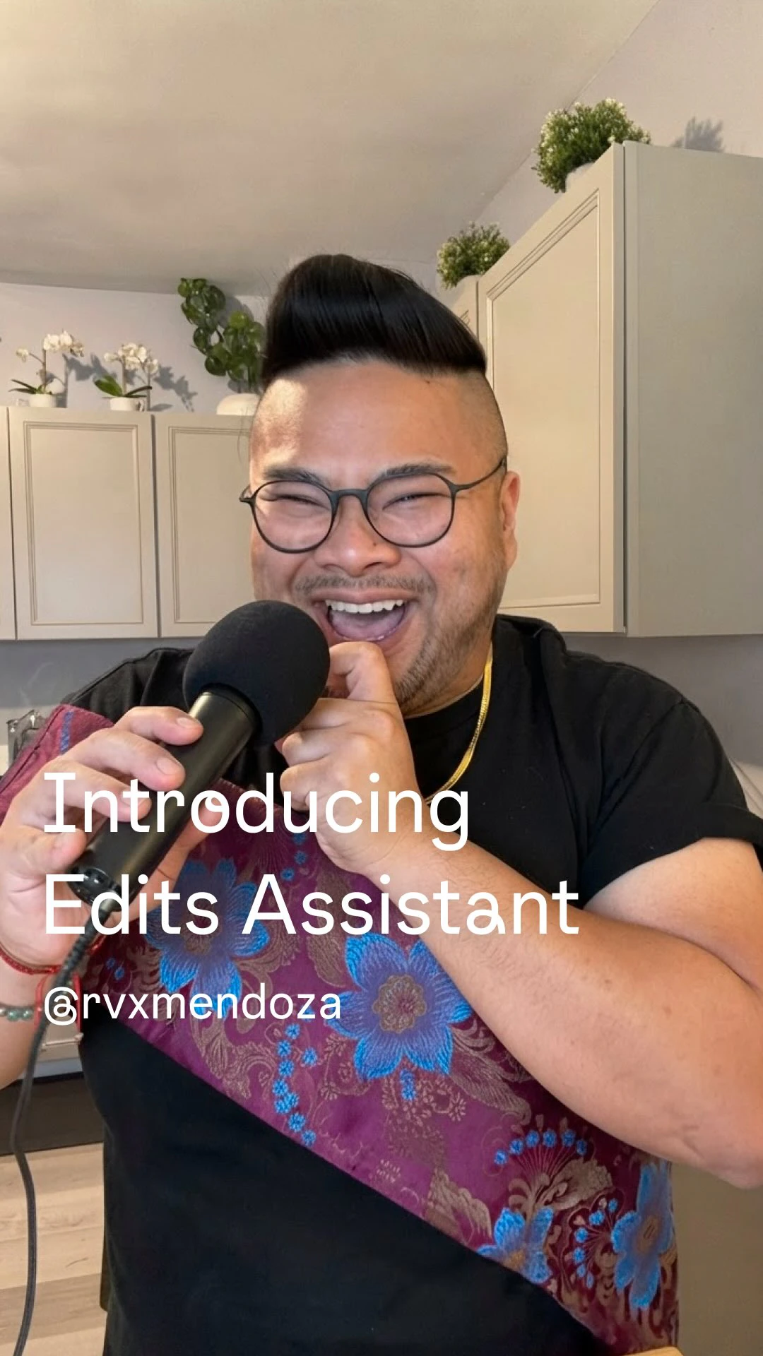I laugh into a microphone beneath the words Introducing Edits Assistant.